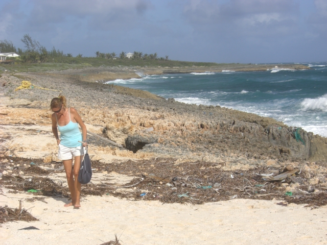 Beachcomber Lori is intent on finding treasure.