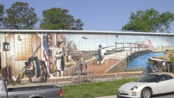 Local sign shop displays mural of Battle at Great Bridge.