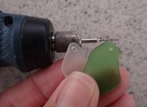 A successful drilling of two pieces, sans drill press.