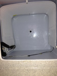 Looking down into the empty freezer; at least it received a good cleaning