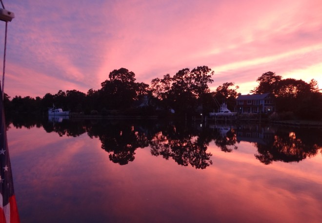 Sunset looking at the shore of the creek opposite the park