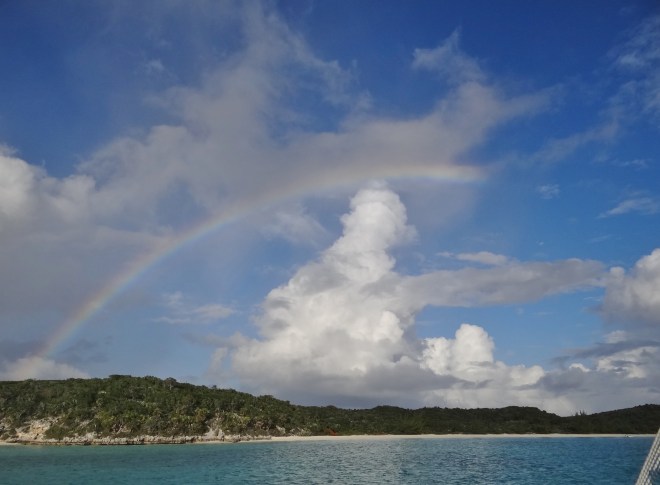 rainbow over beach