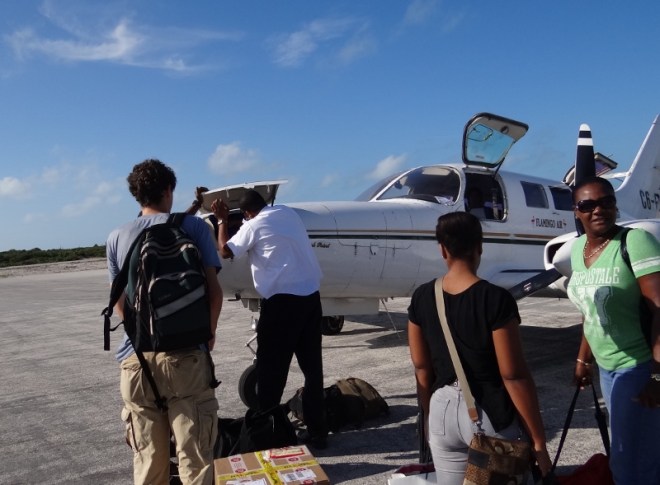 Benj, the multi-talented pilot, Ida and her daughter wait to board (Jan 2013)