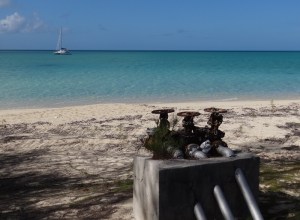 Fuel freighter anchors off the beach and runs in long hoses