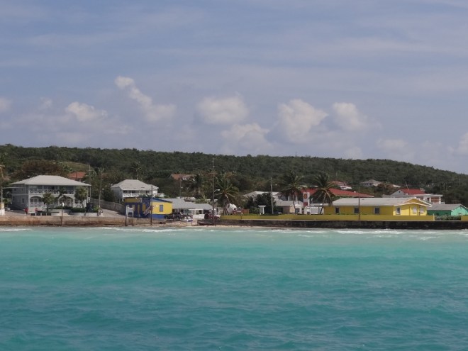 View from our stern of the beach and harbor-side buildings at low tide