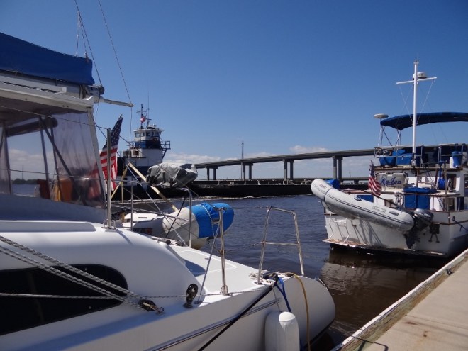 Tug and barge consume much of the creek as they go past