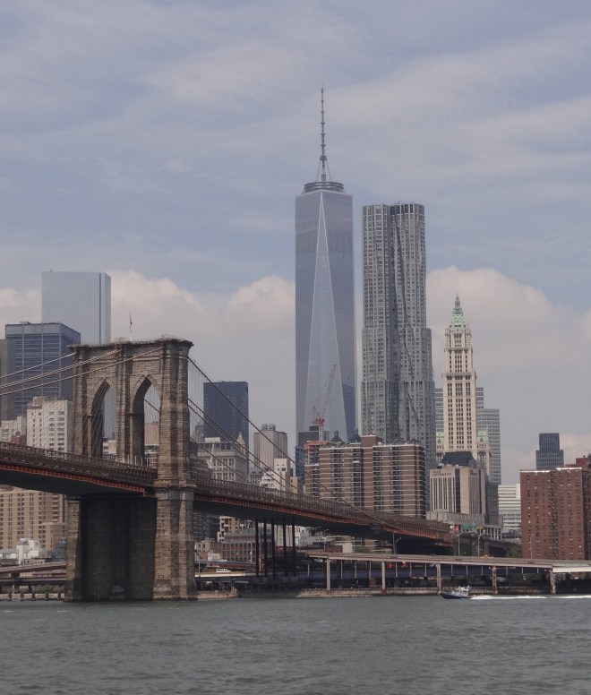 Tower One fills in the skyline with the Brooklyn Bridge (or maybe it's the Manhattan) across the East River