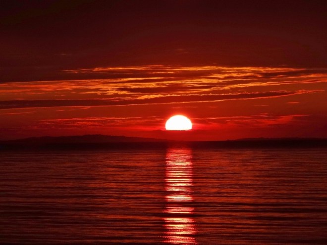 A cloud creates a pillow for the sun