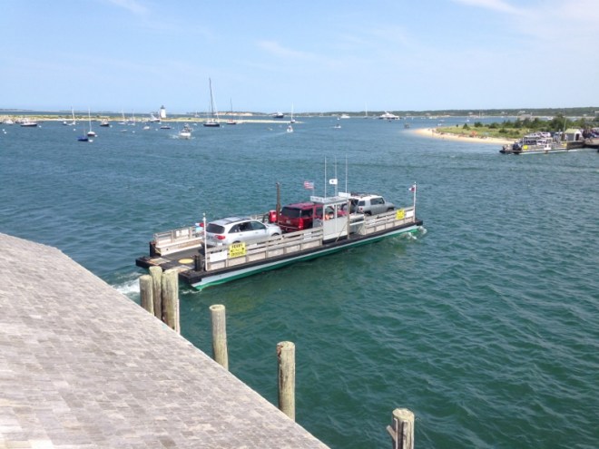 The always on time ferry crosses over to Chappaquiddick by the entrance into the harbor