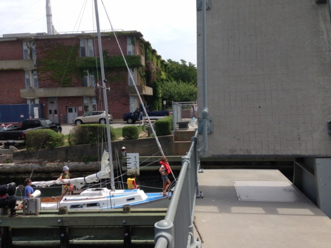 Sailboat departs Eel Pond during the bascule bridge scheduled opening time