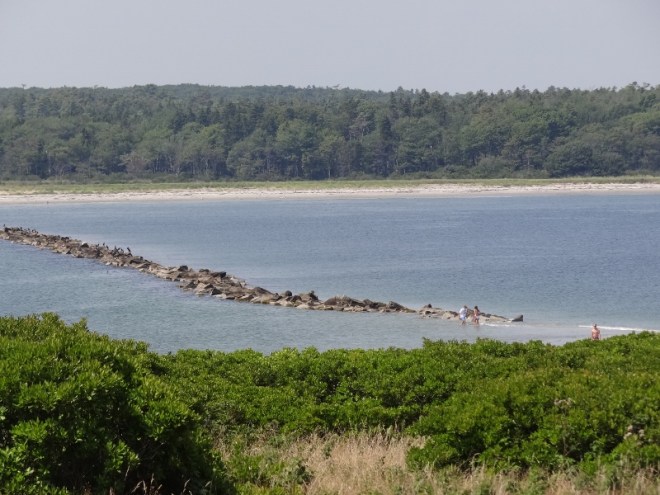 The breakwater becomes more visible with the receding tide 