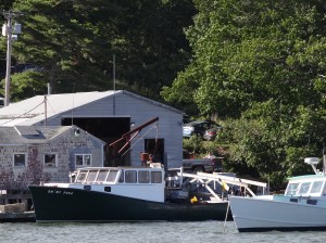 A lobster boat arrives with the day's haul.