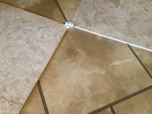 The old tile had faux grout and hid dirt really well