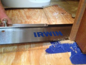 Thicker tile meant trimming the door jamb- just what we need, more tools