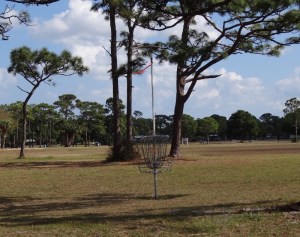 A disc golf basket/hole- the game is played by tossing a small Frisbee-like disc