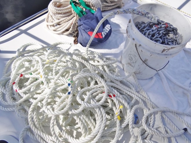 Line marked with tape and chain in bucket, old chain and line in background