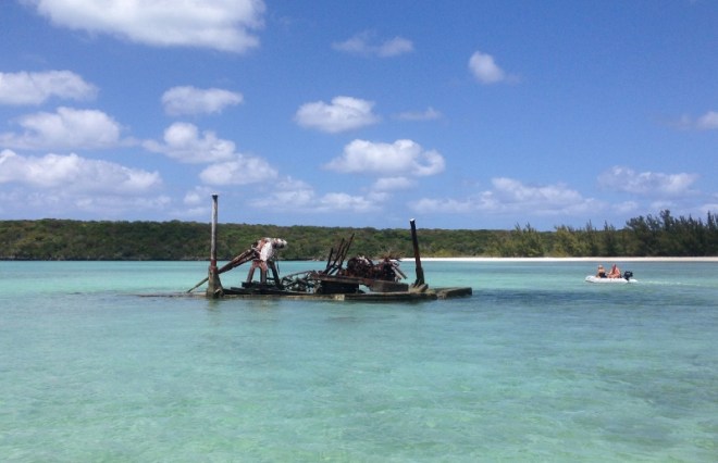 rusting equipment barge creates interest in the shallow waters at Powell Cay