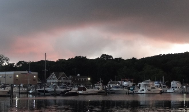 Dark storm clouds loom at sunset